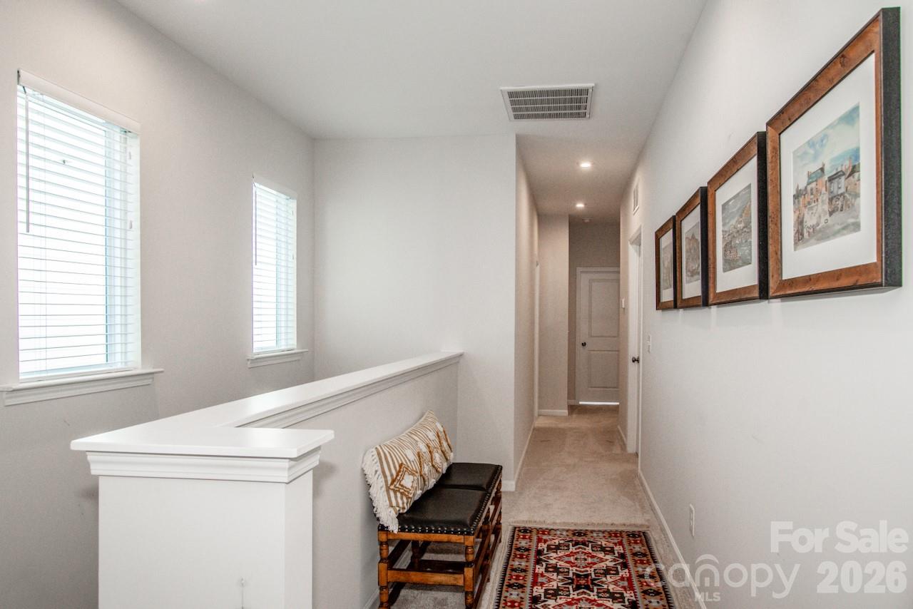 1270 Brawley School Road, Unit F Mooresville, NC 28117 - Photo 29 of 37 a view of hallway with furniture and a window