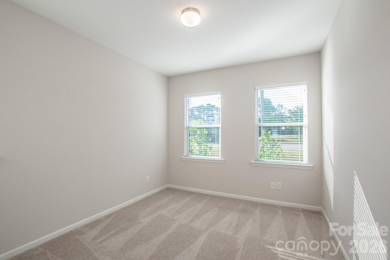 1270 Brawley School Road, Unit F Mooresville, NC 28117 - Photo 31 of 37 an empty room with a window