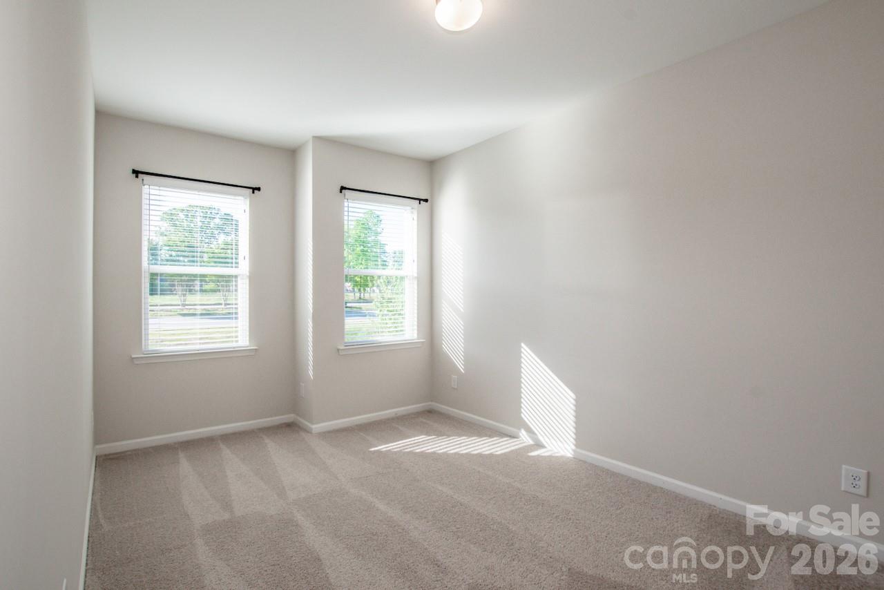 1270 Brawley School Road, Unit F Mooresville, NC 28117 - Photo 32 of 37 an empty room with a window