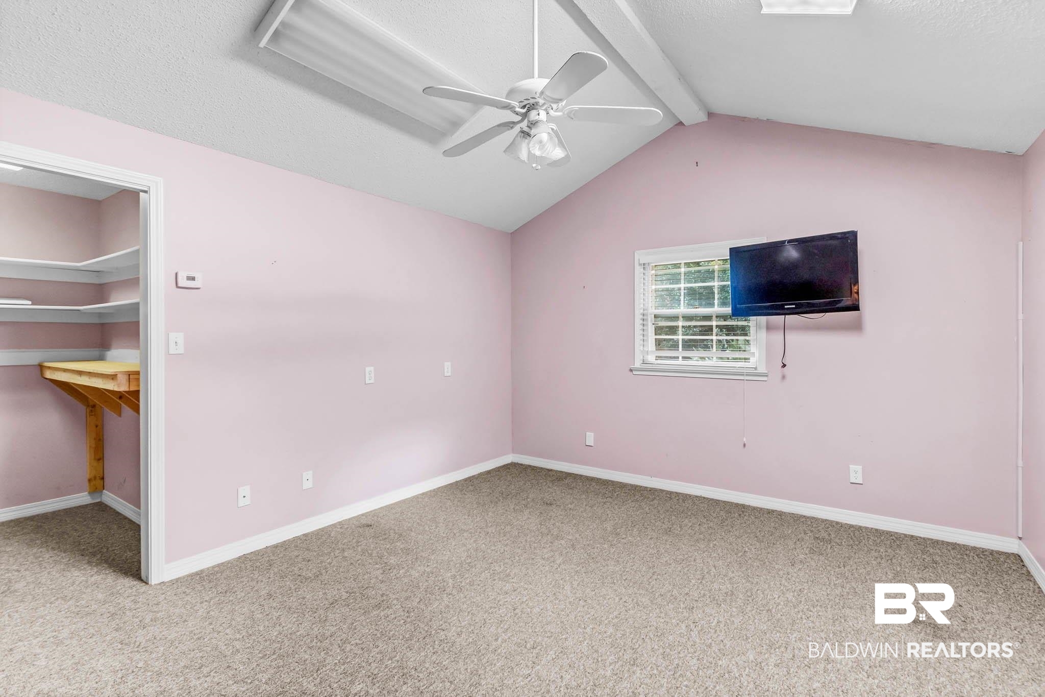 309 West Brandy Run Road Mobile, AL 36608 - Photo 66 of 100 Unfurnished bedroom with carpet floors, a walk in closet, ceiling fan, and a textured ceiling