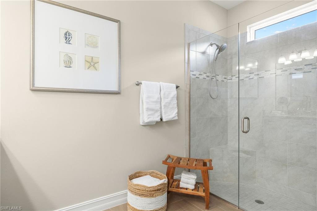 14546 Tropical Drive Naples, FL 34114 - Photo 17 of 38 a bathroom with a toilet and a shower