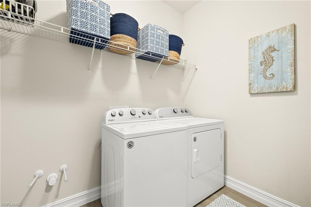 14546 Tropical Drive Naples, FL 34114 - Photo 22 of 38 a utility room with dryer and washer