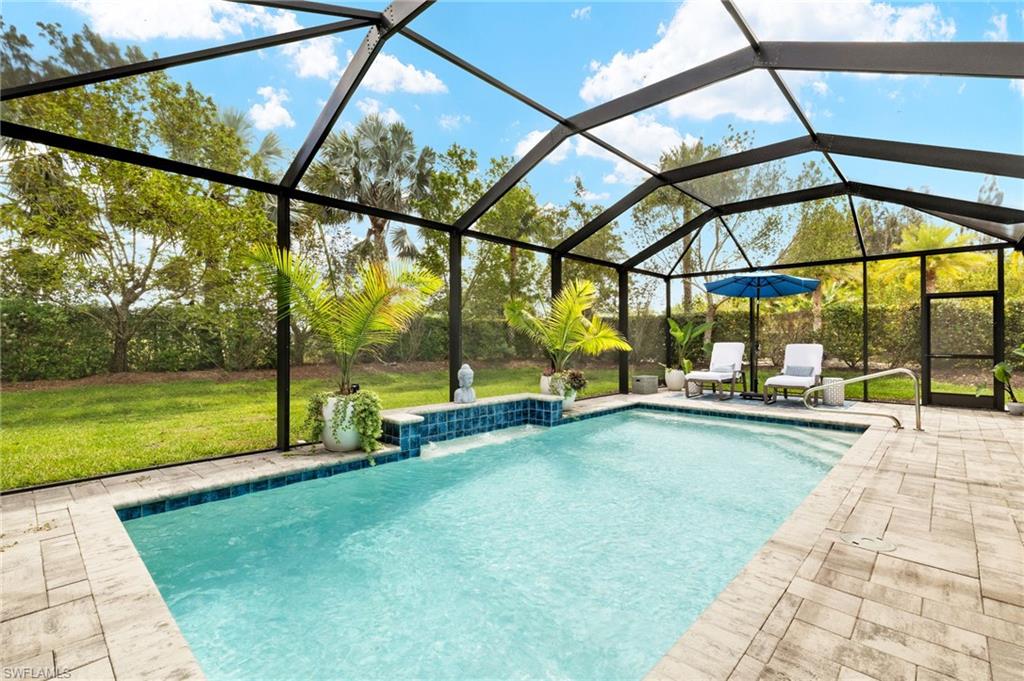 14546 Tropical Drive Naples, FL 34114 - Photo 26 of 38 a view of swimming pool with a yard