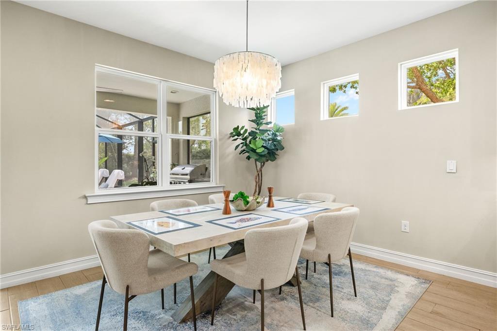 14546 Tropical Drive Naples, FL 34114 - Photo 6 of 38 a dining room with furniture and window