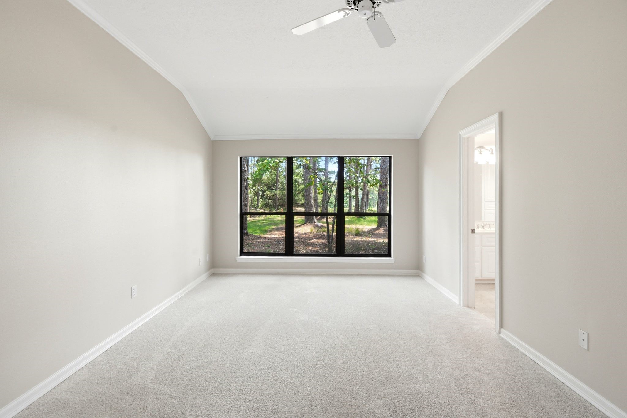 22509 Pebble Beach Way Point Blank, TX 77364 - Photo 18 of 30 Primary suite, second view, with en-suite access and greenbelt views