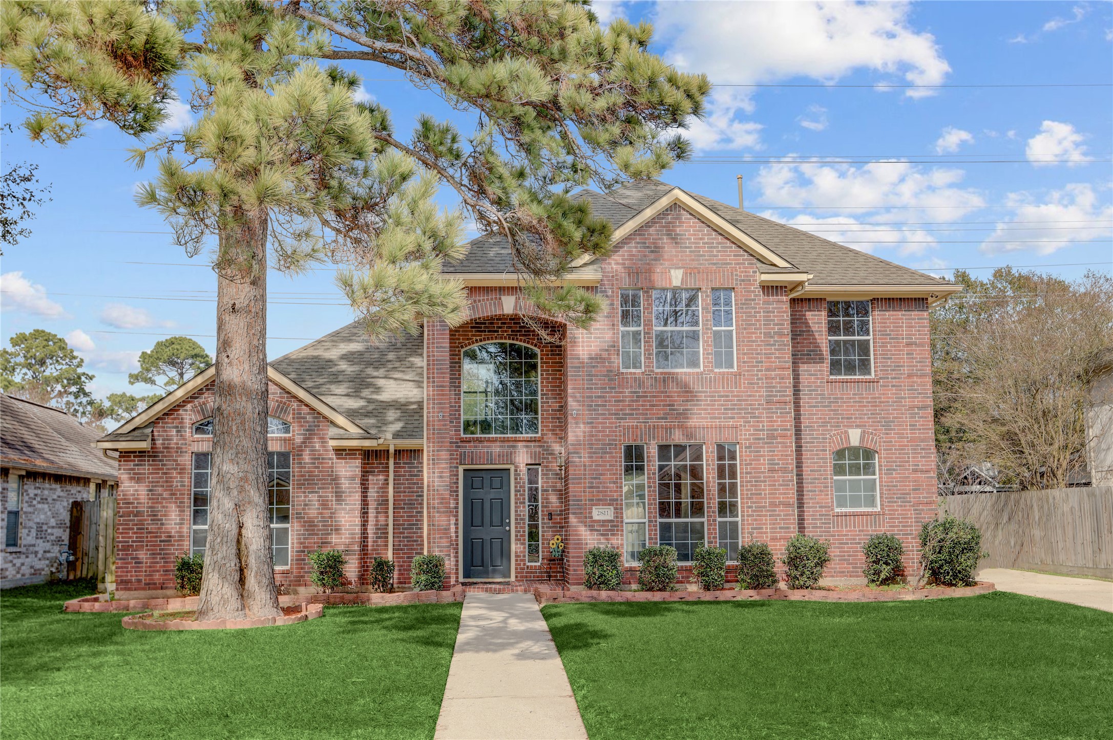 front view of a house with a yard