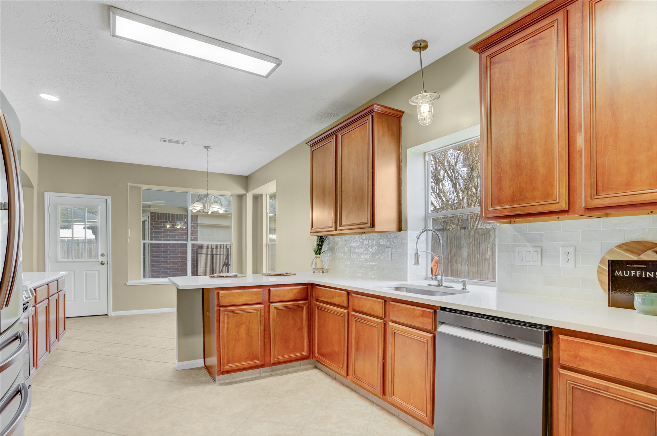2811 Travick Lane Houston, TX 77073 - Photo 11 of 33 a kitchen with stainless steel appliances granite countertop a sink stove and cabinets