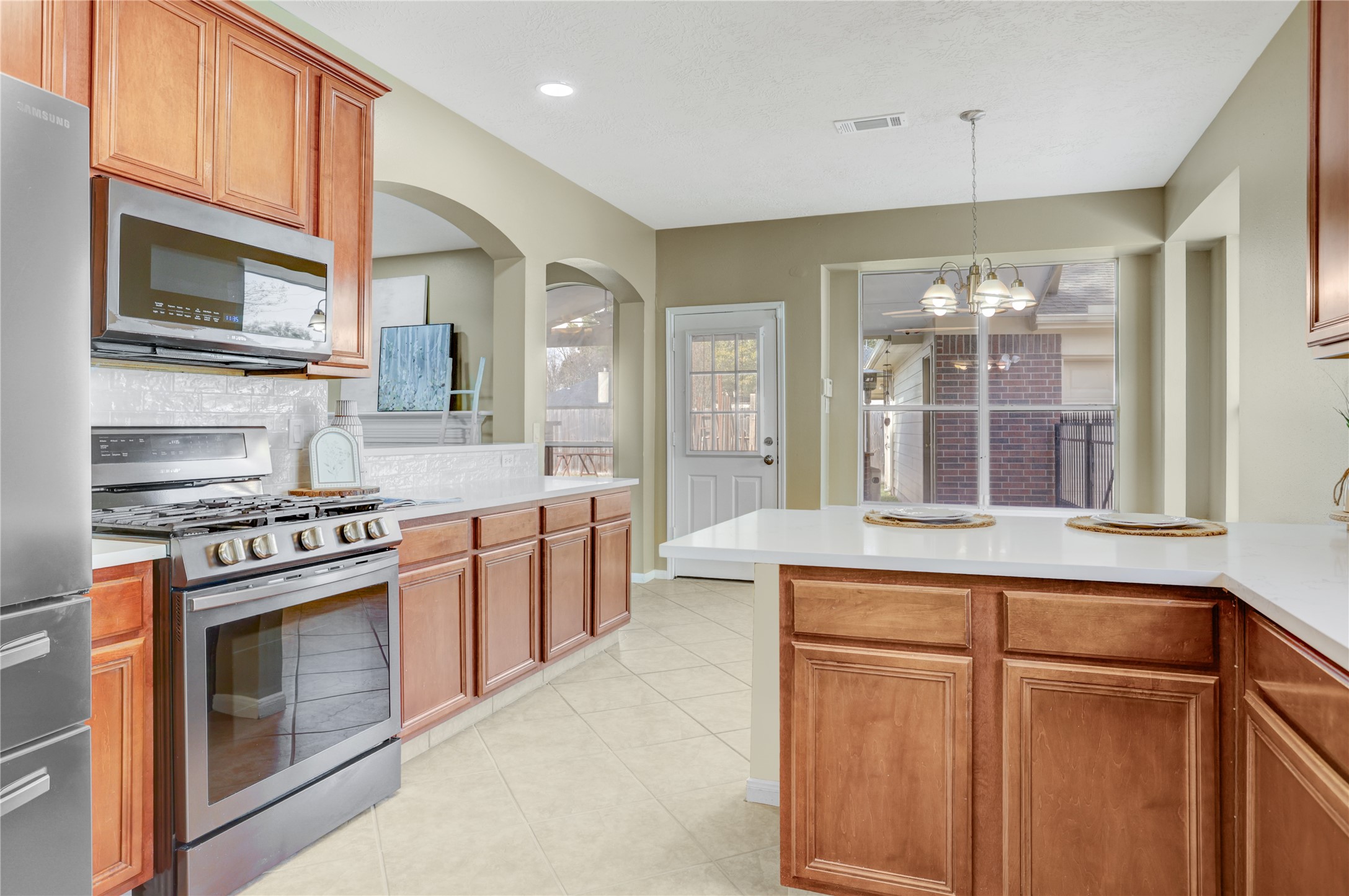 2811 Travick Lane Houston, TX 77073 - Photo 12 of 33 a kitchen with stainless steel appliances granite countertop a stove and a sink
