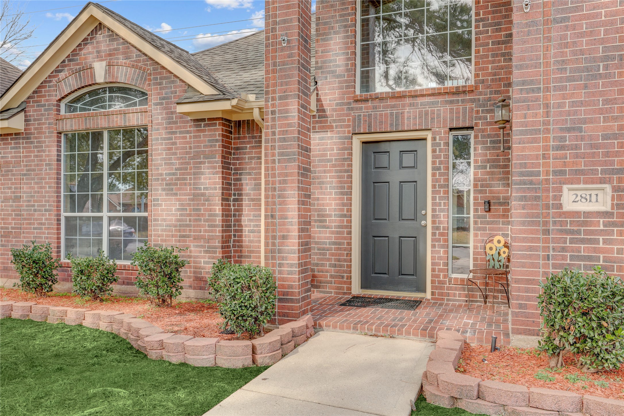 2811 Travick Lane Houston, TX 77073 - Photo 2 of 33 a front view of a house with garden