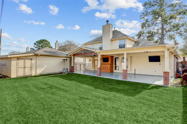 a front view of a house with a garden and yard