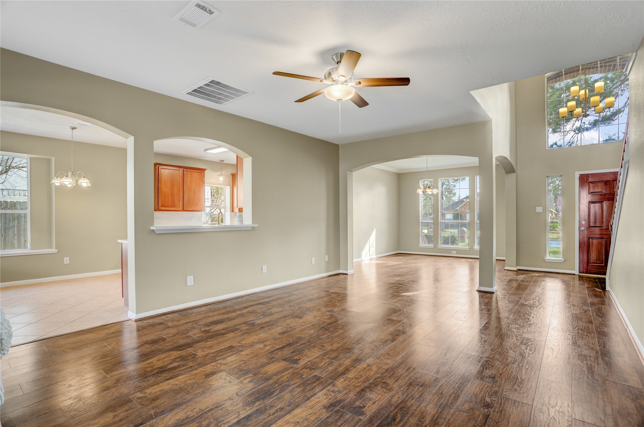 2811 Travick Lane Houston, TX 77073 - Photo 7 of 33 a view of an empty room with wooden floor and a window