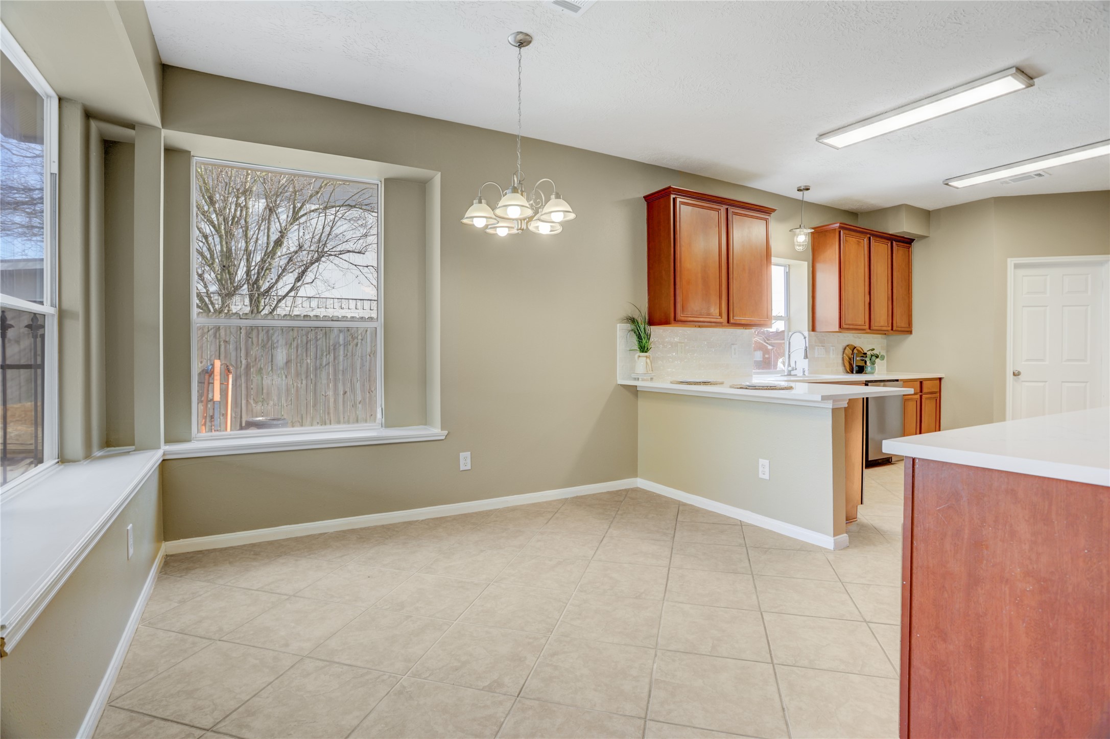 2811 Travick Lane Houston, TX 77073 - Photo 9 of 33 a room with a window and chandelier