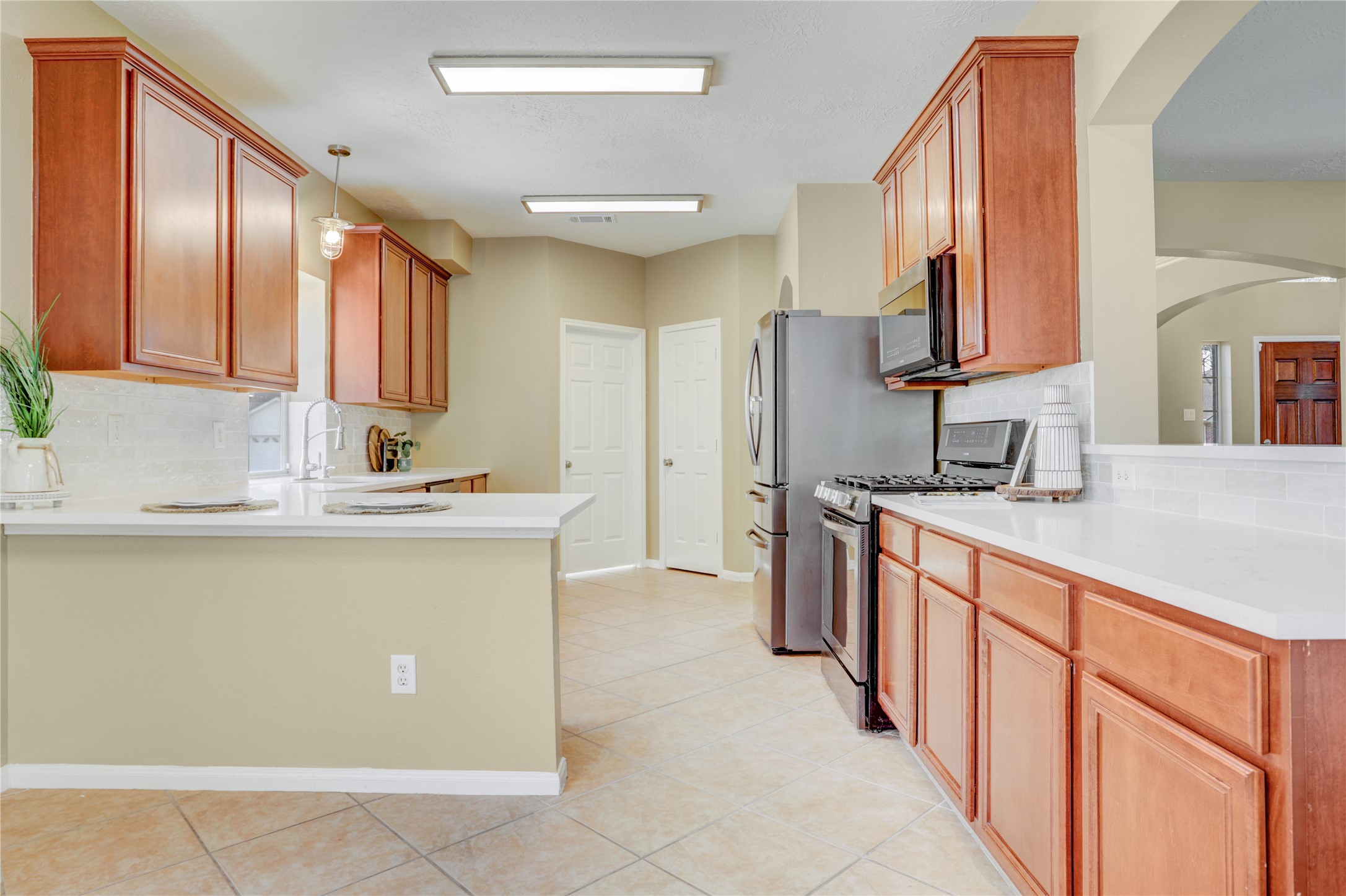 2811 Travick Lane Houston, TX 77073 - Photo 10 of 33 a kitchen with stainless steel appliances granite countertop a sink and a refrigerator