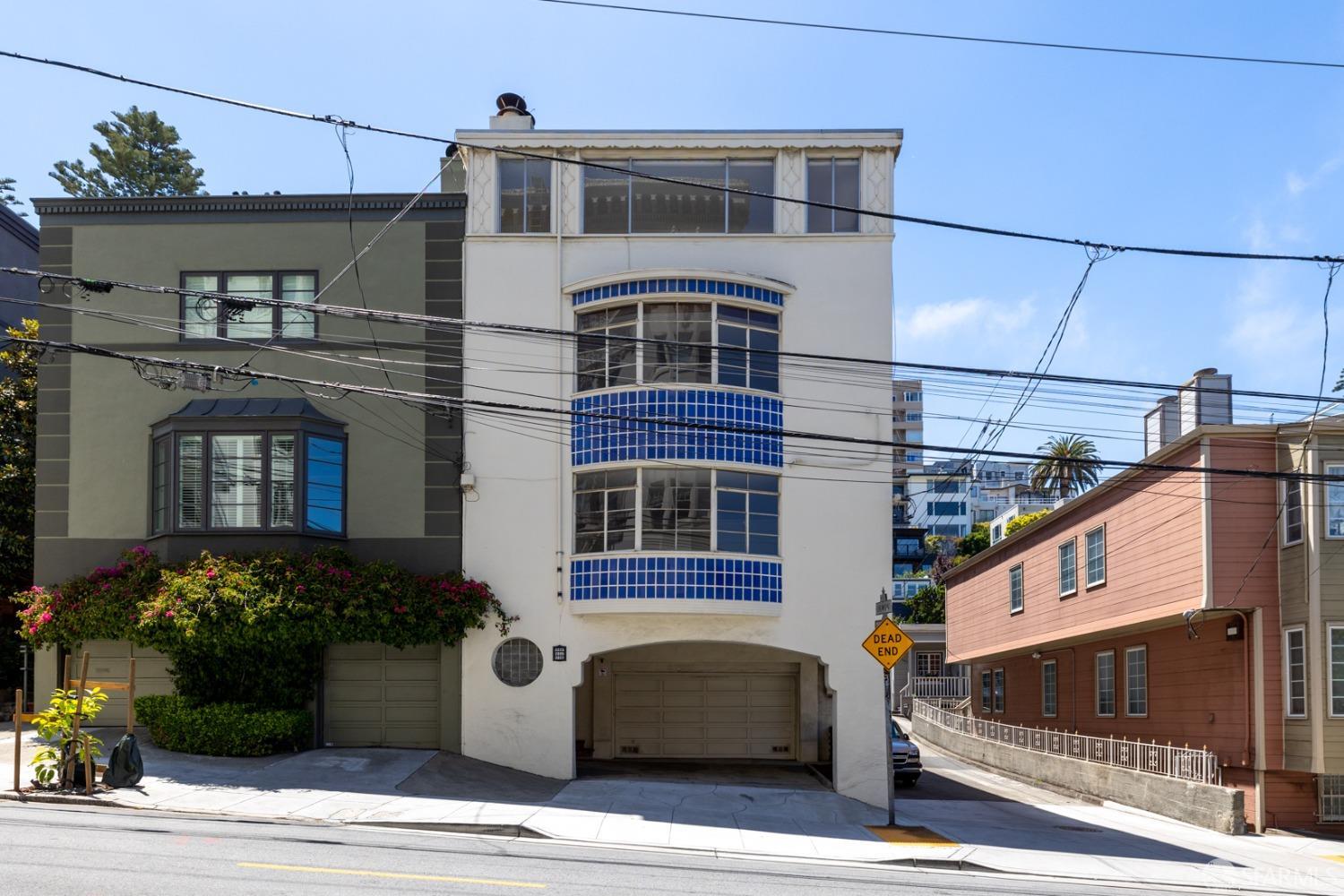 2223-2227 Leavenworth Street San Francisco, CA 94109 - Photo 1 of 36 a front view of a house with a garage
