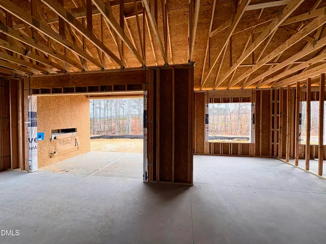 a view of an empty room with a fireplace
