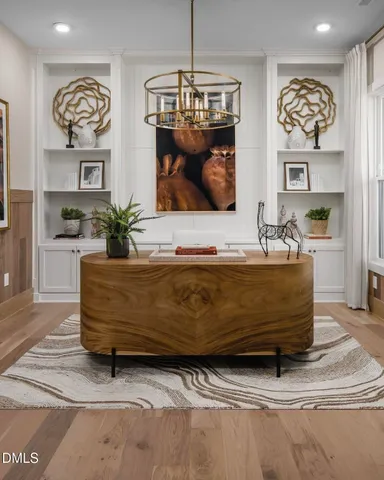 a living room with fireplace furniture and decor