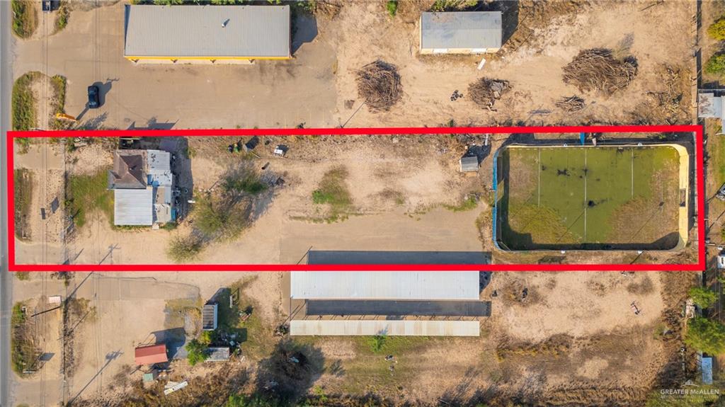 3500 West Mile 5 Road Mission, TX 78574 - Photo 12 of 22 a small white building with red and white umbrellas