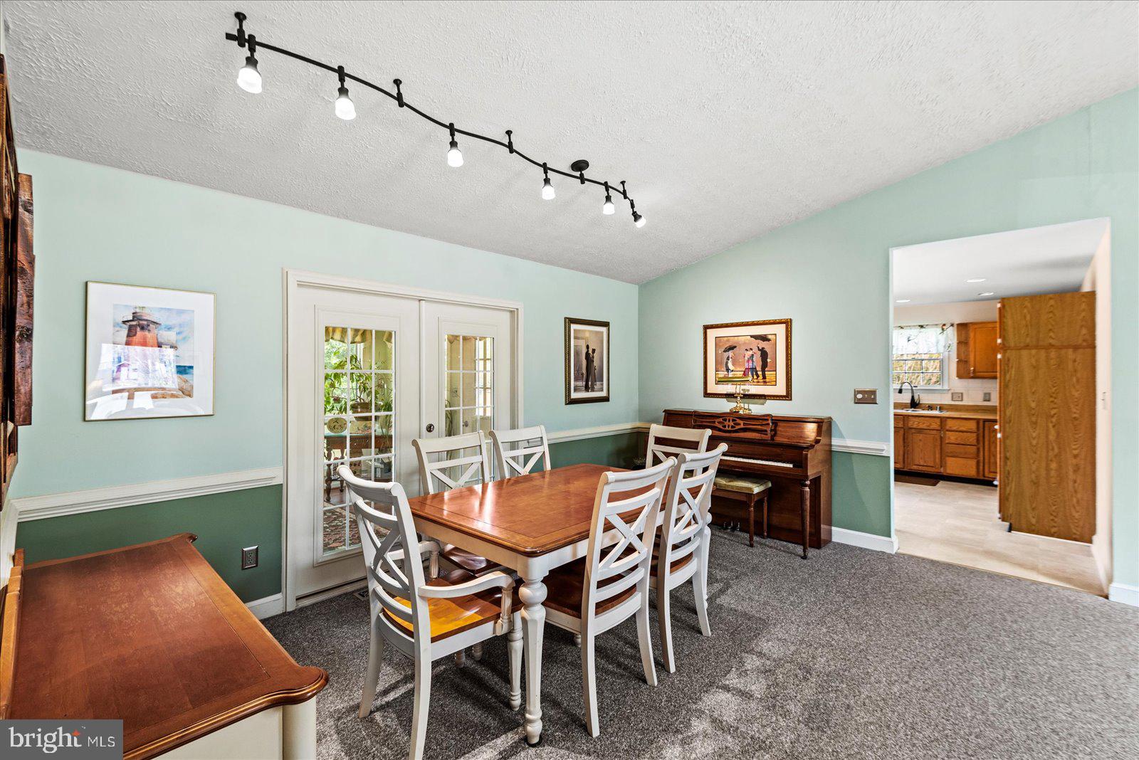 121 11th Street Colonial Beach, VA 22443 - Photo 11 of 33 a view of a dining room with furniture and a livingroom