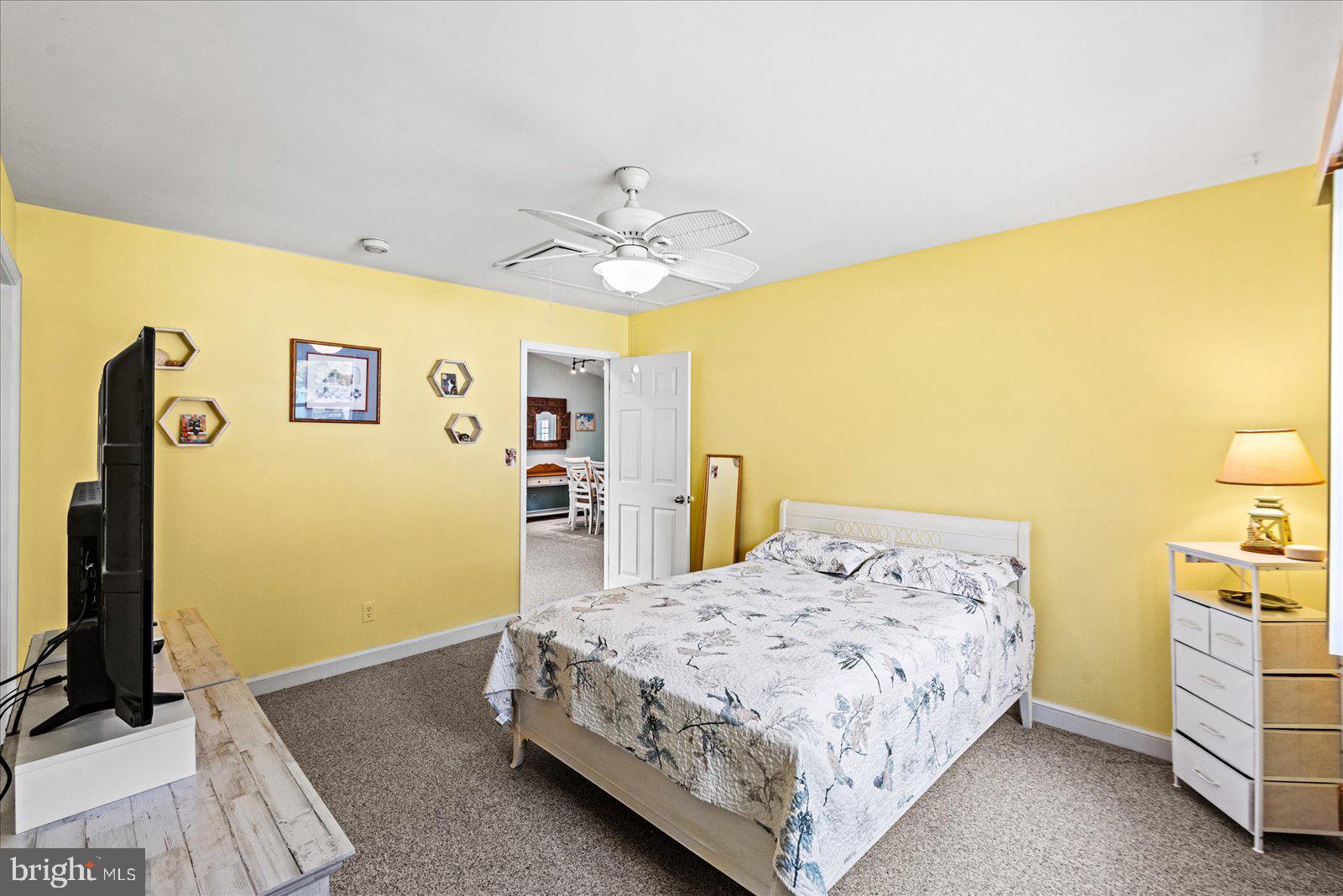 121 11th Street Colonial Beach, VA 22443 - Photo 17 of 33 a bedroom with a bed and a flat screen tv
