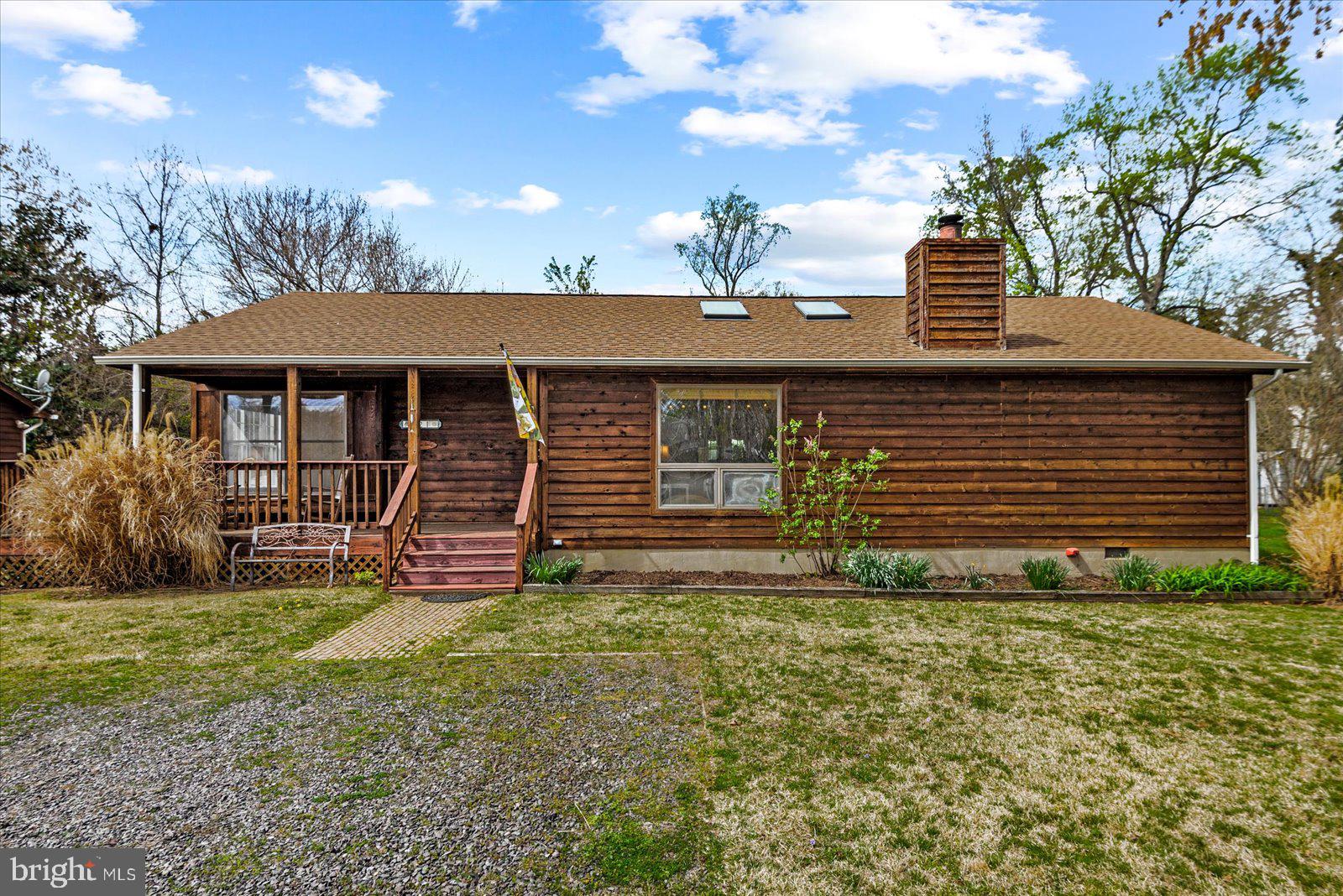 121 11th Street Colonial Beach, VA 22443 - Photo 2 of 33 a front view of a house with garden
