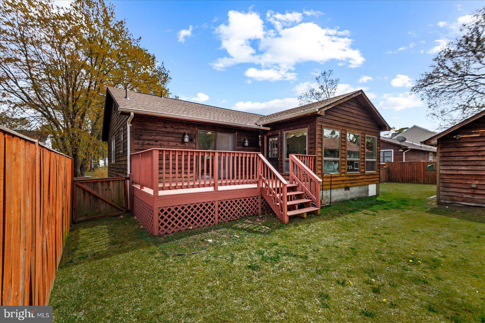 121 11th Street Colonial Beach, VA 22443 - Photo 30 of 33 a view of a backyard with a garden and deck