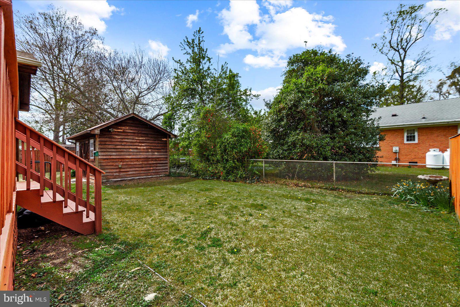 121 11th Street Colonial Beach, VA 22443 - Photo 32 of 33 a backyard of a house with lots of green space