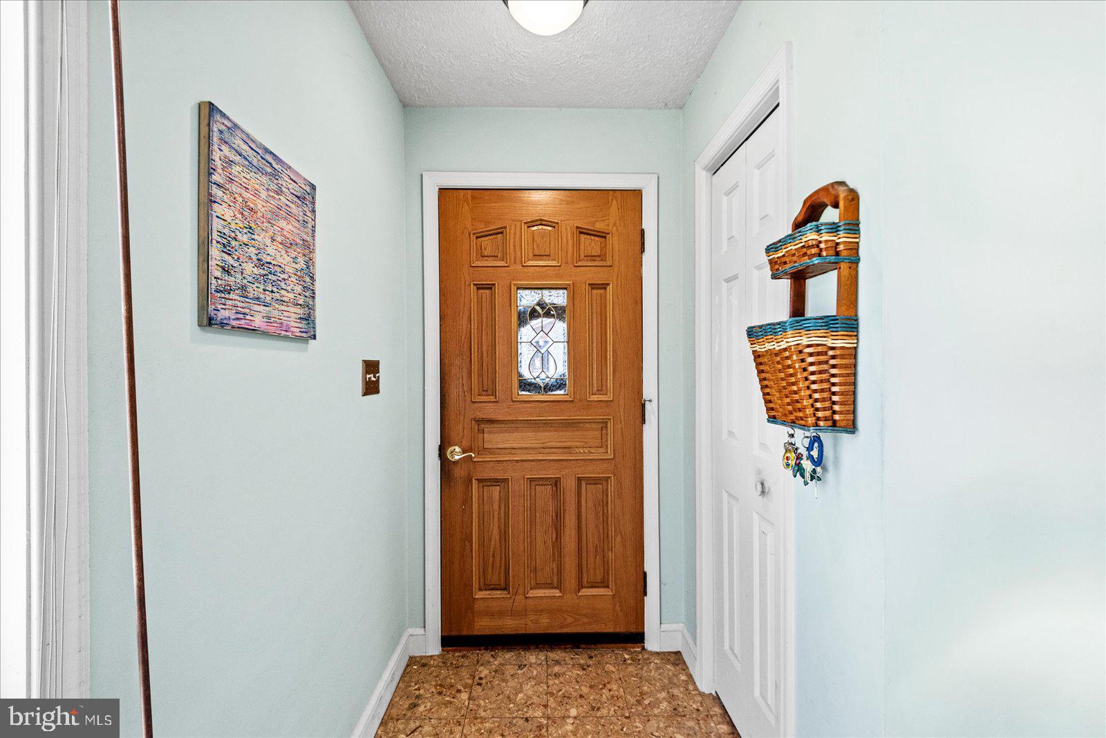 121 11th Street Colonial Beach, VA 22443 - Photo 6 of 33 a view of front door with wooden floor