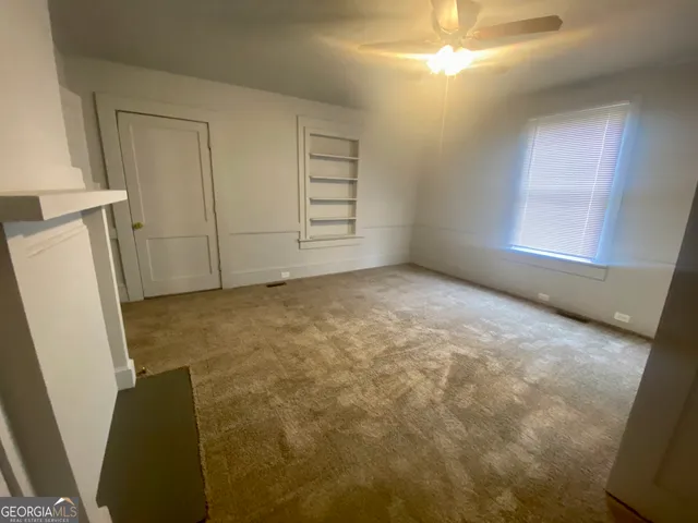 a view of an empty room and window