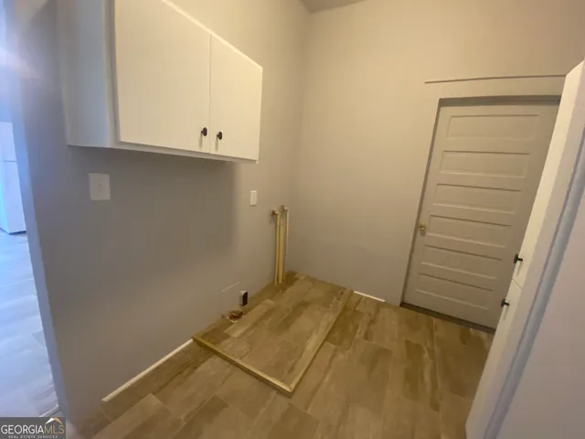 a view of a porch with wooden floor and stairs