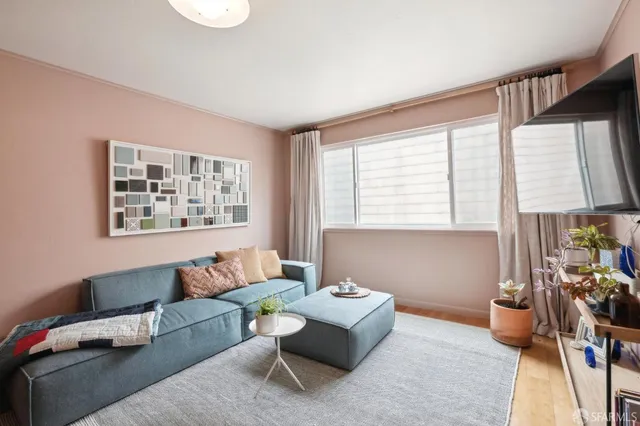a living room with furniture and a window