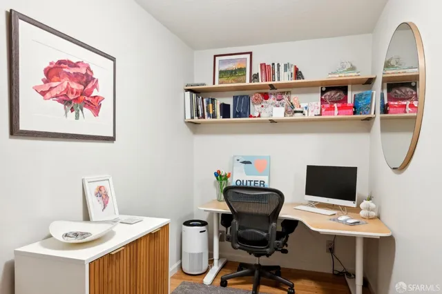 a view of a workspace with furniture