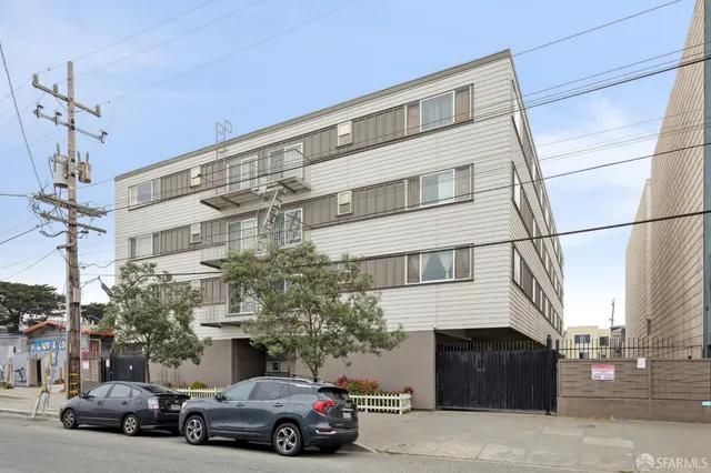 a view of a car parked in front of a building