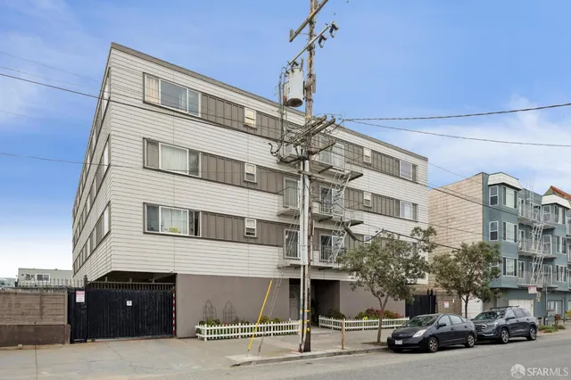 a front view of a building with a street