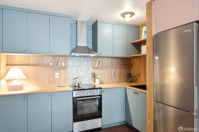 a kitchen with a refrigerator and a sink