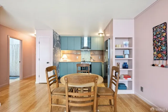 a view of a dining room with furniture and wooden floor