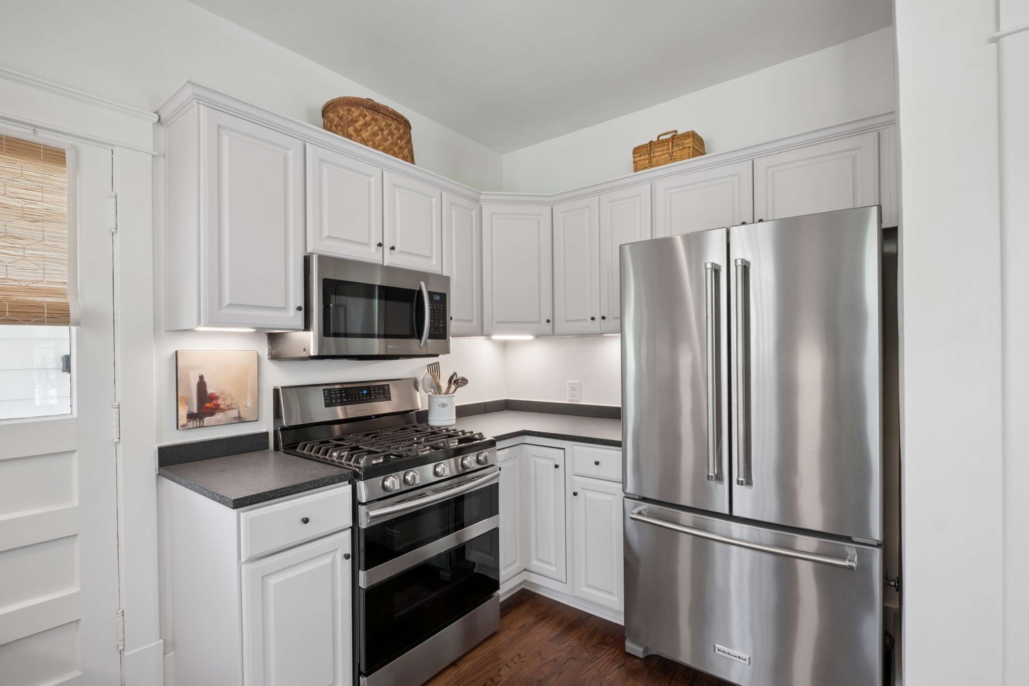 4402 Harding Place, Unit 4 Nashville, TN 37205 - Photo 16 of 35 a kitchen with refrigerator a microwave and cabinets