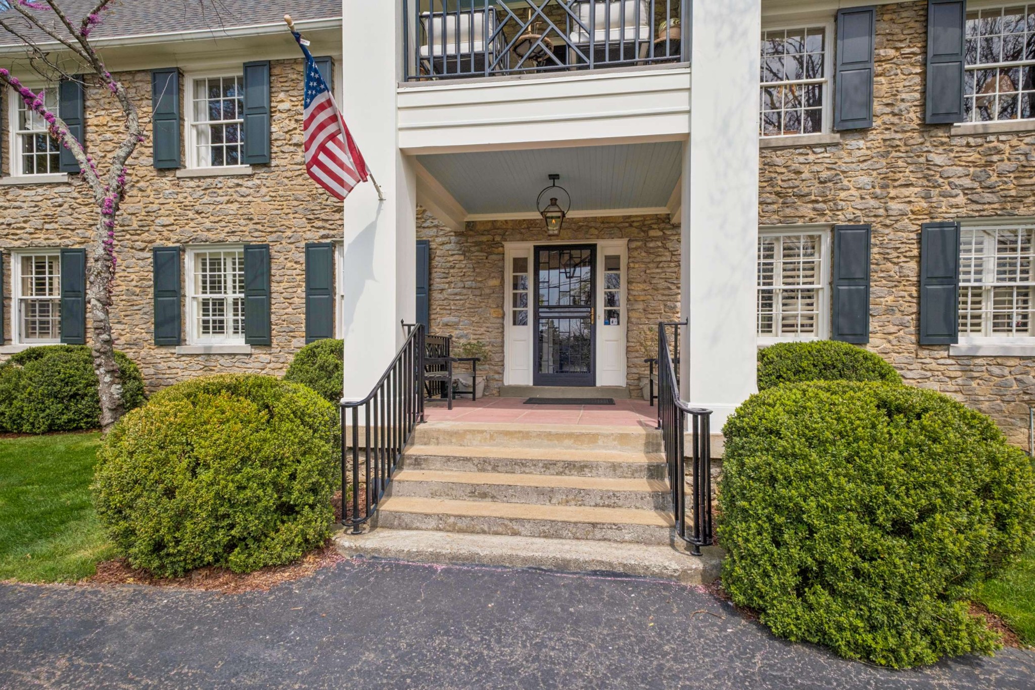 4402 Harding Place, Unit 4 Nashville, TN 37205 - Photo 2 of 35 a view of a house with potted plants and a fountain