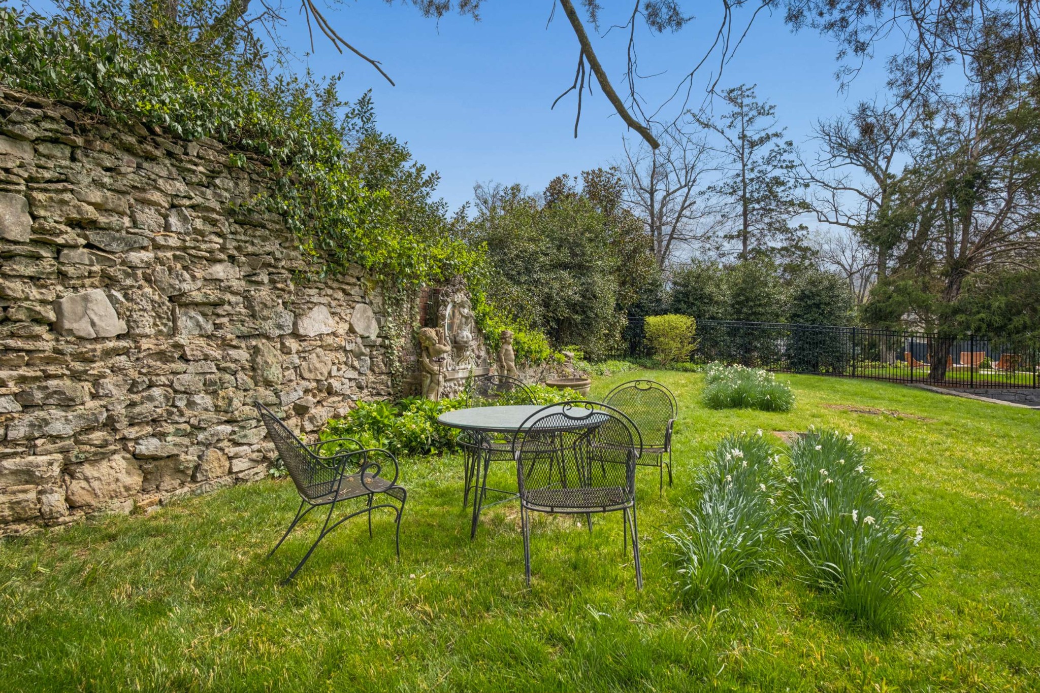 4402 Harding Place, Unit 4 Nashville, TN 37205 - Photo 35 of 35 a view of a chair and table in backyard