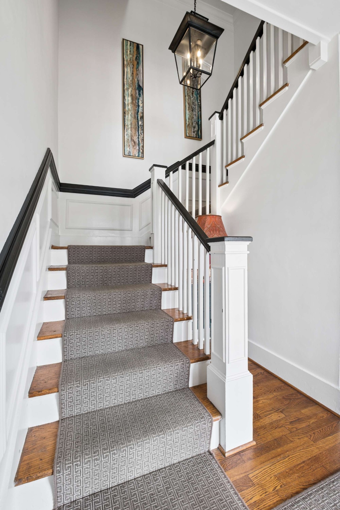 4402 Harding Place, Unit 4 Nashville, TN 37205 - Photo 4 of 35 a view of staircase with white walls and a rug