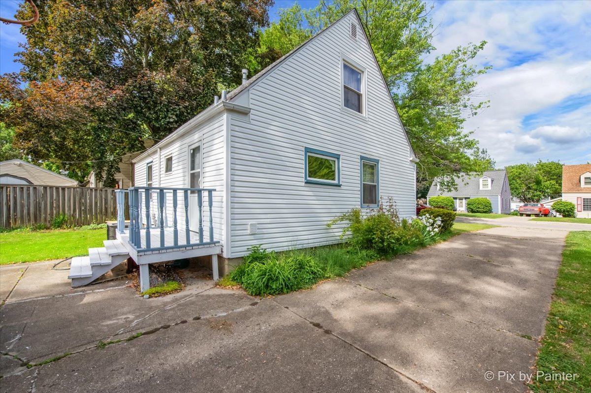 510 South Alfred Avenue Elgin, IL 60123 - Photo 7 of 7 a view of a house with a yard and a garden