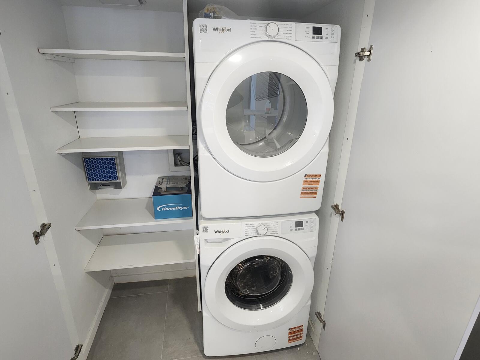 520 Brickell Key Drive, Unit A1200 Miami, FL 33131 - Photo 13 of 21 a utility room with dryer and washer