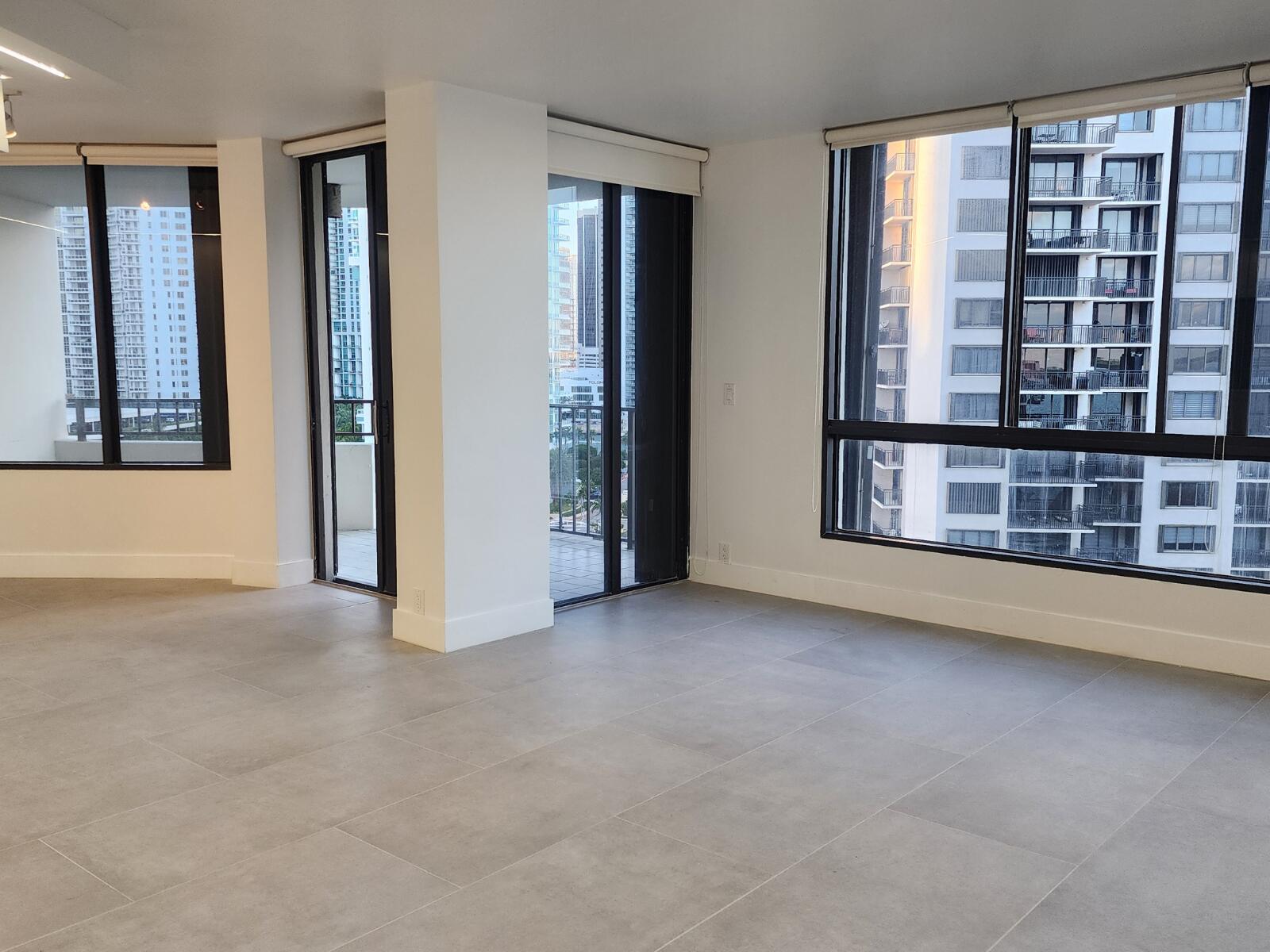 520 Brickell Key Drive, Unit A1200 Miami, FL 33131 - Photo 5 of 21 an empty room with windows