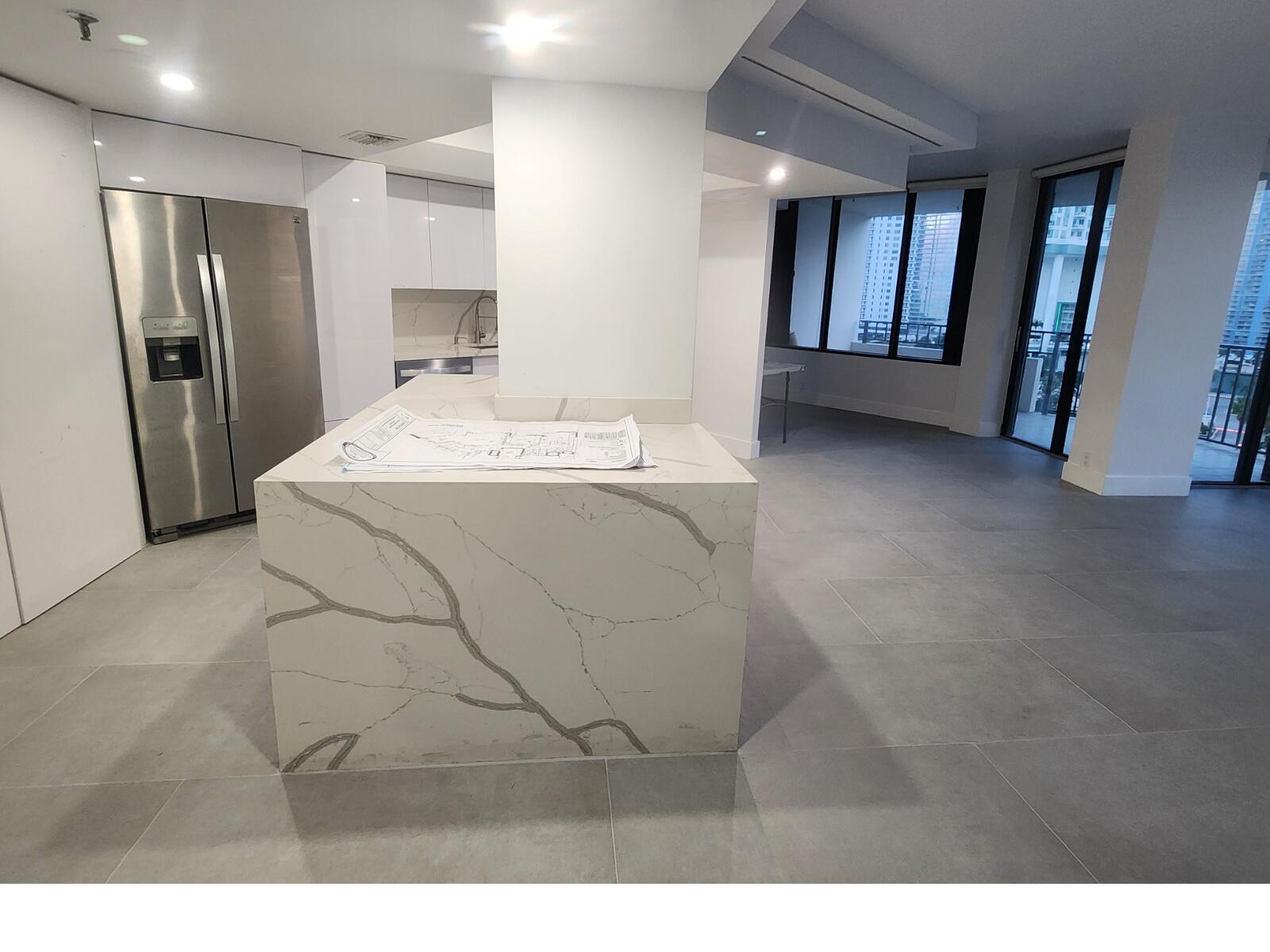 520 Brickell Key Drive, Unit A1200 Miami, FL 33131 - Photo 6 of 21 a view of a refrigerator in kitchen and entryway