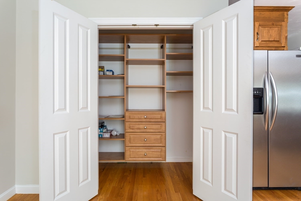 49 Beaver Street, Unit 49 Franklin, MA 02038 - Photo 9 of 46 a view of walk in closet with empty racks