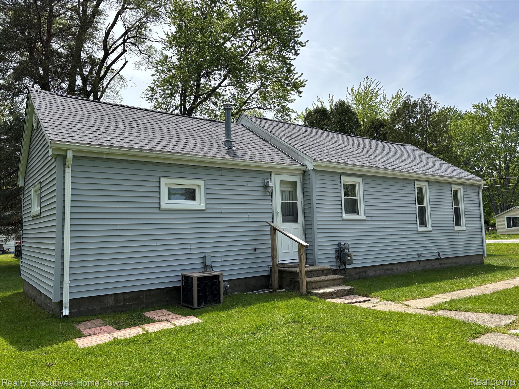 1782 Maple Road Smiths Creek, MI 48074 - Photo 6 of 30 View of side of property featuring a yard