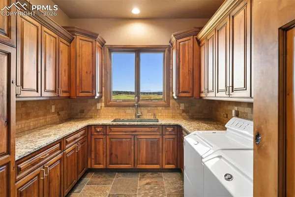 a kitchen with a sink and a window