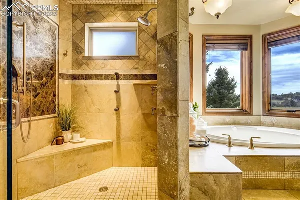 a bathroom with a tub and a sink