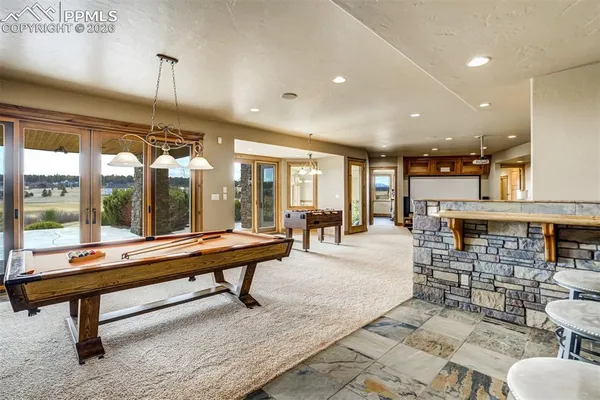 a room with lots of furniture and view of living room