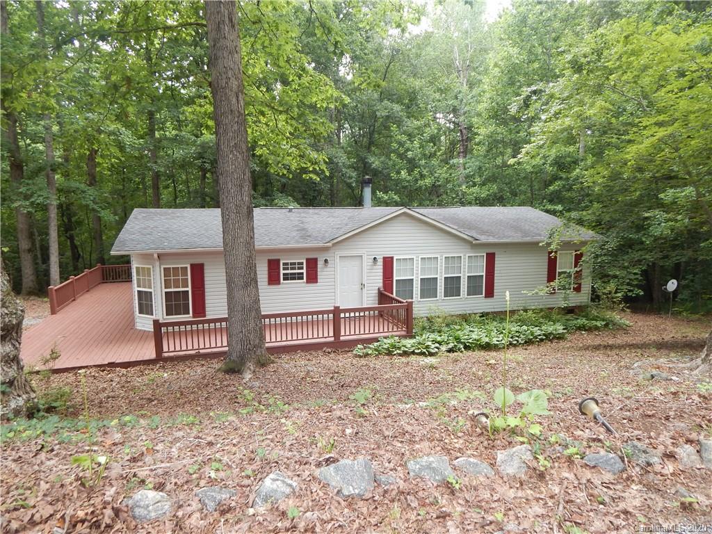 1936 Coopers Gap Road Rutherfordton, NC 28139 - Photo 1 of 32 a front view of a house with garden