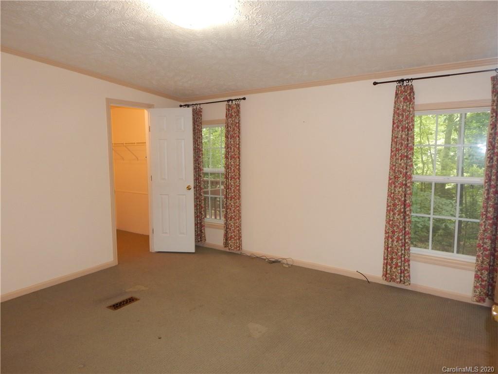 1936 Coopers Gap Road Rutherfordton, NC 28139 - Photo 15 of 32 a view of an empty room with a window